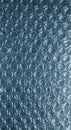 Clear plastic bubble wrap packaging material is illuminated from behind, showcasing its protective air-filled cells and shiny Royalty Free Stock Photo