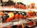 Clear plastic clamshell containers of fresh ripe berries