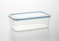 Clear plastic food container with blue lid isolated on white background Royalty Free Stock Photo