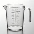 Clear plastic measuring cup with handle and measurement markings Royalty Free Stock Photo