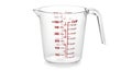 Clear plastic measuring cup with red markings and handle Royalty Free Stock Photo