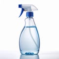 Clear Plastic Spray Bottle with Blue Nozzle and Water on White Backdrop Royalty Free Stock Photo