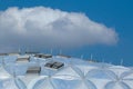 Clear plastic structured modern dome shaped public building detail. blue sky and white clouds