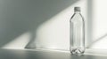 Clear Plastic Water Bottle Lit by Soft Window Light on Neutral Background Royalty Free Stock Photo