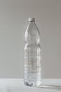 A clear plastic water bottle on a white table Royalty Free Stock Photo