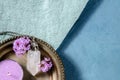 Clear quartz crystal charm with vervain flowers and a scented candle, shot from the top with copy space