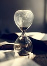 Clear sandglass on wooden table