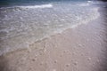 Clear sea water on white sand beach. Tropical seaside retro photo. Marine holiday. Shallow seawater. Seashore landscape. Royalty Free Stock Photo