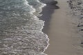 Clear sea water on white sand beach. Sea wave on sandy beach. Tropical seaside photo. Marine holiday.