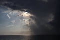 Clear sky and storm clouds on the sea. half the sky is clear, half are storm clouds. hurricane coming. storm coming on the ocean, Royalty Free Stock Photo