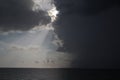 Clear sky and storm clouds on the sea. half the sky is clear, half are storm clouds. hurricane coming. storm coming on the ocean, Royalty Free Stock Photo