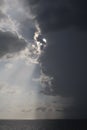 Clear sky and storm clouds on the sea. half the sky is clear, half are storm clouds. hurricane coming. storm coming on the ocean, Royalty Free Stock Photo