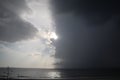 Clear sky and storm clouds on the sea. half the sky is clear, half are storm clouds. hurricane coming. storm coming on the ocean, Royalty Free Stock Photo