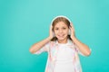 Clear sound. Girl child listen music with modern headphones. Kid little girl listen music headphones. Music account