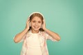 Clear sound. Girl child listen music with modern headphones. Kid little girl listen music headphones. Music account