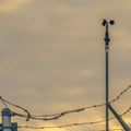 Clear Square Chain link fence with barbed wire securing a Power Plant in Utah Valley Royalty Free Stock Photo