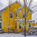 Clear Square Charming homes on a snow covered landscape during winter in Daybreak Utah