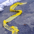 Clear Square Close up of a yellow Caution tape on a road in Eagle Mountain Utah