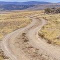 Clear Square Dirt road with a stunning view of mountain and blue sky in the distance