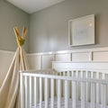 Clear Square Interior of a room for children with white wooden crib and play teepee