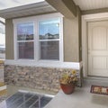 Clear Square White front door and reflective window of a home against road and cloudy sky Royalty Free Stock Photo