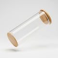 Clear storage jar with bamboo lid, floating in mid air horizontally, on solid white background Royalty Free Stock Photo