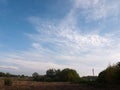 a clear sunny field outside peace wonderful nature no people cloud streaks in peace Royalty Free Stock Photo