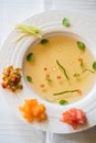 Clear tomato soup with chopped vegetables Royalty Free Stock Photo