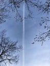 Clear traces of two planes in the blue sky on a clear day Royalty Free Stock Photo