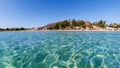 Clear turquoise water of Aegean sea and Caraincir beach. Beautiful Mediterranean seascape of ripple water with sunbeams reflection