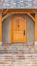 Clear Vertical Entryway of home framed with leafless hibernating trees on the yard in winter