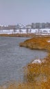 Clear Vertical Oquirrh lake with view of snowy lakefront homes Royalty Free Stock Photo