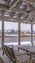 Clear Vertical Snowy patio of a clubhouse overlooking Oquirh Lake Royalty Free Stock Photo