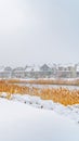 Clear Vertical Trail on the powdery snow along Oquirrh Lake with view of homes and vast sky