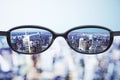 Clear vision concept with eyeglasses and night megapolis city ba Royalty Free Stock Photo