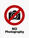 No photography sign featuring a camera icon with a red prohibition circle symbolizing photography restrictions in public or Royalty Free Stock Photo