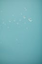 Clear water drops on blue background Royalty Free Stock Photo