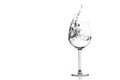 Clear water splashing in the wine glass. Royalty Free Stock Photo