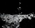 Clear water surface on a black with ripple and bubbles