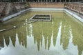 Clear waters of pool at historical Monte Oliveto Maggiore abbey, Siena, Italy