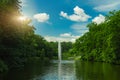 Clear weather day park landscape wallpaper nature photography pond waters and fountain nature scenic view green trees foliage blue Royalty Free Stock Photo