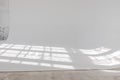 Clear white cyclorama. Light background with sun light and shadows. Plain wall empty photo studio. Royalty Free Stock Photo