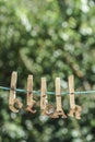 CLEAR word written by hanged wooden letters on rope at garden