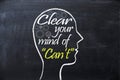 Clear your mind of can`t phrase inside human head shape drawn on chalkboard Royalty Free Stock Photo