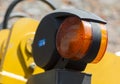 Warning orange clearance light of road machinery close-up
