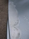 Clearcoat Peeling off of an Old Silver Car