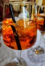 Clearglass with Aperol Spritz and ice cubes