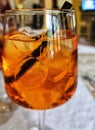 Clearglass with Aperol Spritz and ice cubes