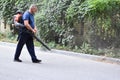 Clearing leaves from the road. Road cleaning outside.