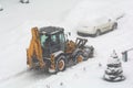 Clearing the road from snow. February snowfall Royalty Free Stock Photo